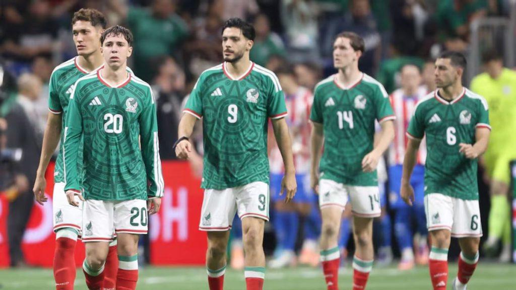 Group of Mexican National Team Soccer Players Walking on the Pitch in Green Jerseys with Numbers 20, 9, 14 and 6 Visible, After a Match. - Glen Facturero