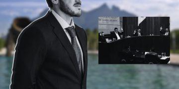 Man in a Dark Suit and Tie Stands in the Foreground Outdoors by a Blurred Lake, with a Black-and-white Inset of a Formal Meeting Panel Raising Hands. - Glen Facturero
