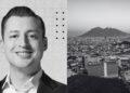 Portrait of a Smiling Man in a Suit on the Left; Grayscale Abstract Background. on the Right, a Grayscale Cityscape with a Distant Mountain. - Glen Facturero